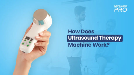Close-up of hand holding UltraCare PRO portable ultrasound therapy device with silver transducer and digital controls