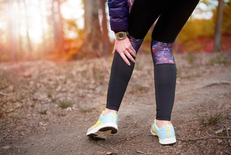 person-outdoors-running-holding-back-of-knee-in-pain