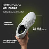 White sneaker with Proformance Gel Insoles held by a hand on a dark background